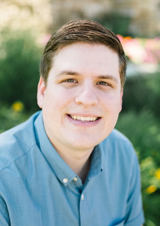 outdoor-portrait-of-a-young-man-in-a-blue-collared-shirt-smiling